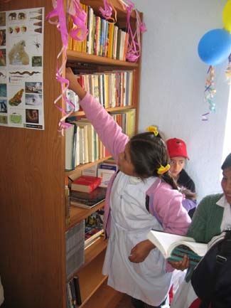 villaserrano.opening.girl.b Checking out the new books!